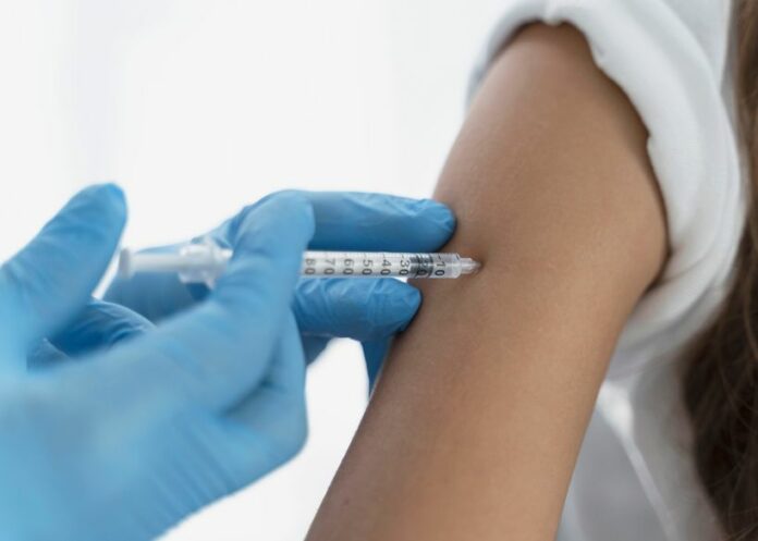 181716055 - close up doctor vaccinating little girl